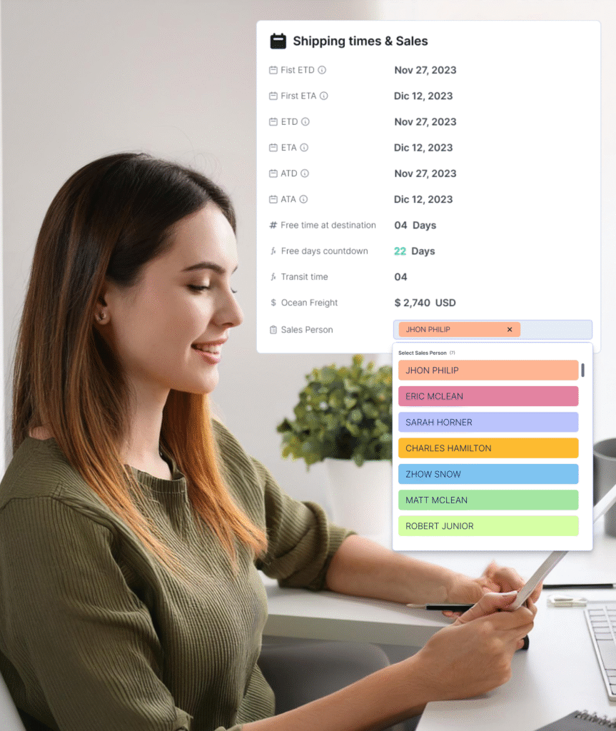 Professional woman using an iPad updating a dynamic spreadsheet showing shipments with dates, sales, and assigned sales representative